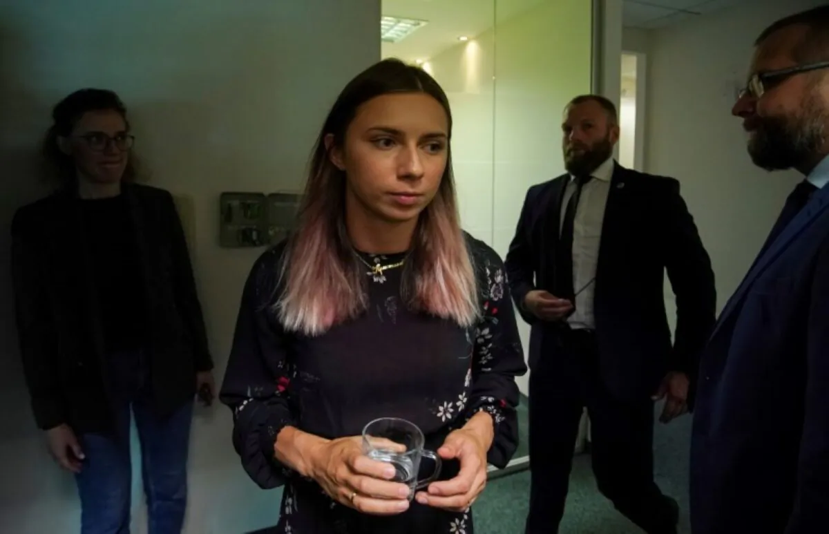 Belarusian sprinter Krystsina Tsimanouskaya, who left the Olympic Games in Tokyo and seeks asylum in Poland, walks to attend an interview with Reuters in Warsaw, Poland, on Aug. 5, 2021. (Darek Golik/Reuters)