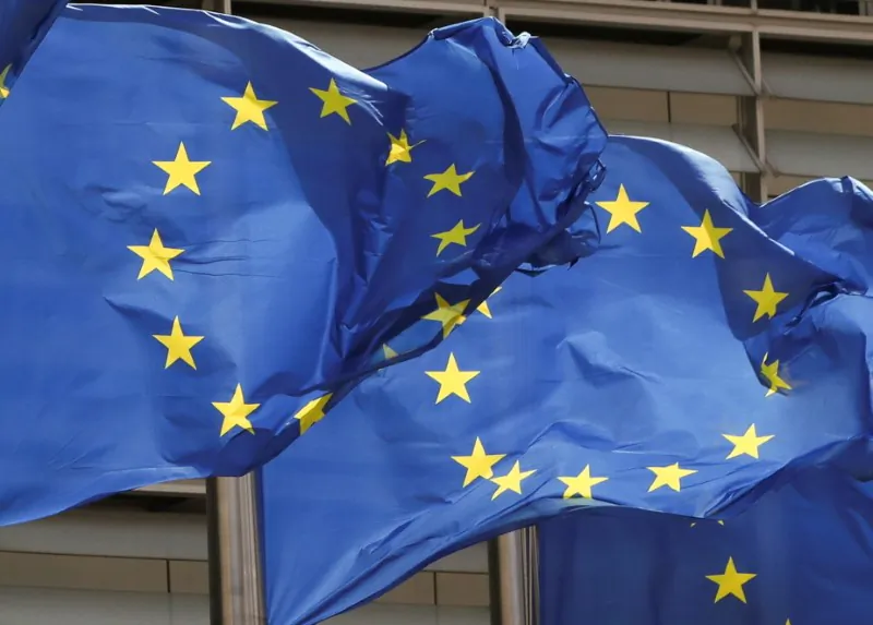 European Union flags flutter outside the EU Commission headquarters in Brussels, Belgium, on May 5, 2021. (Yves Herman/Reuters)