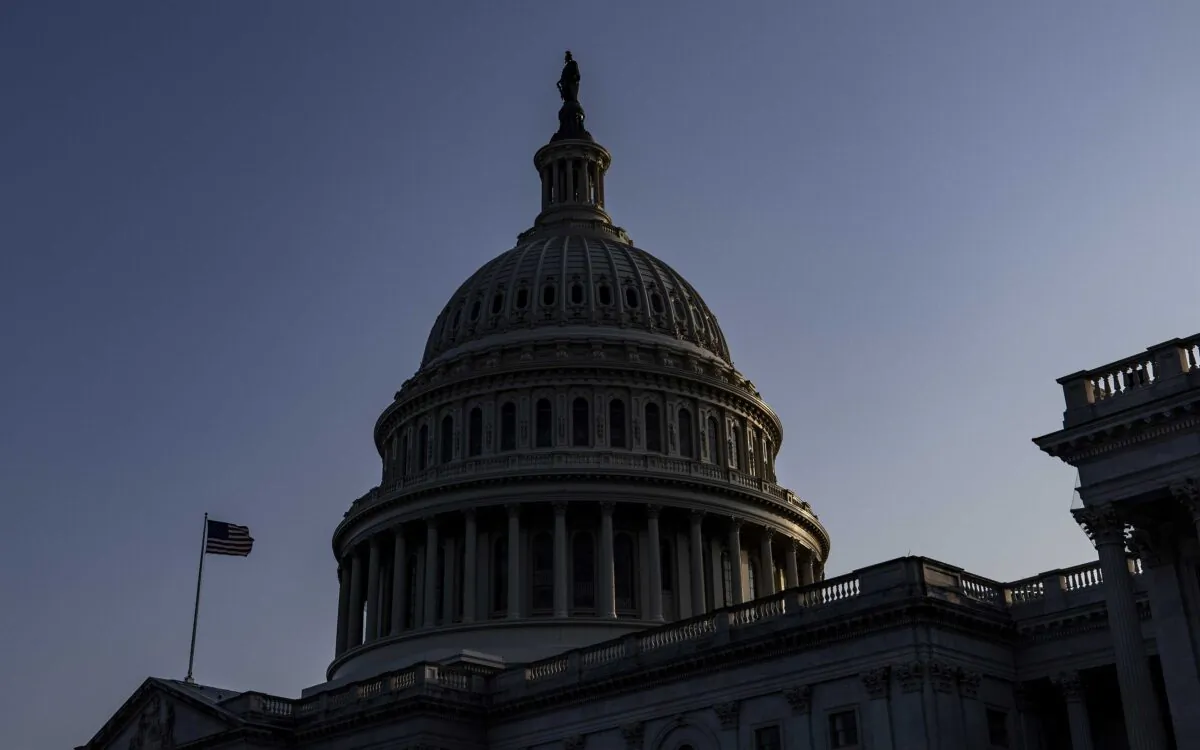 The sun begins to set behind the U.S. Capitol building in Washington on Aug. 8, 2021. (Samuel Corum/Getty Images)
