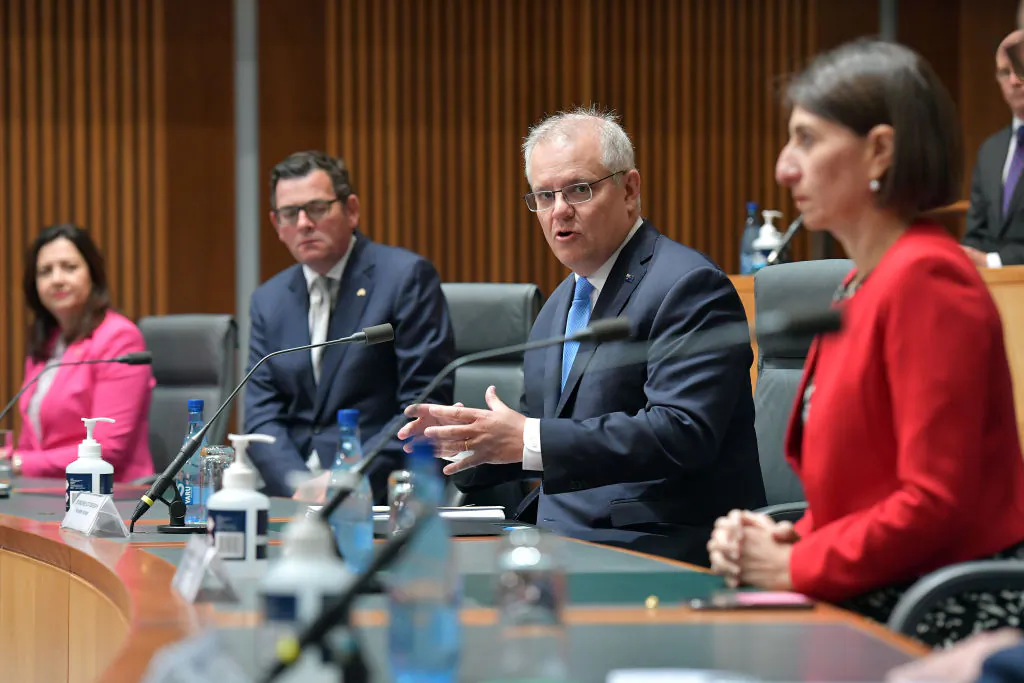 Former Australian Prime Minister Scott Morrison (centre) together with State Premiers Annastacia Palaszczuk (left), Daniel Andrews and former leader Gladys Berejiklian address the media in the Main Committee Room at Parliament House, in Canberra, Australia, on December 11, 2020. Sam Mooy/Getty Images)