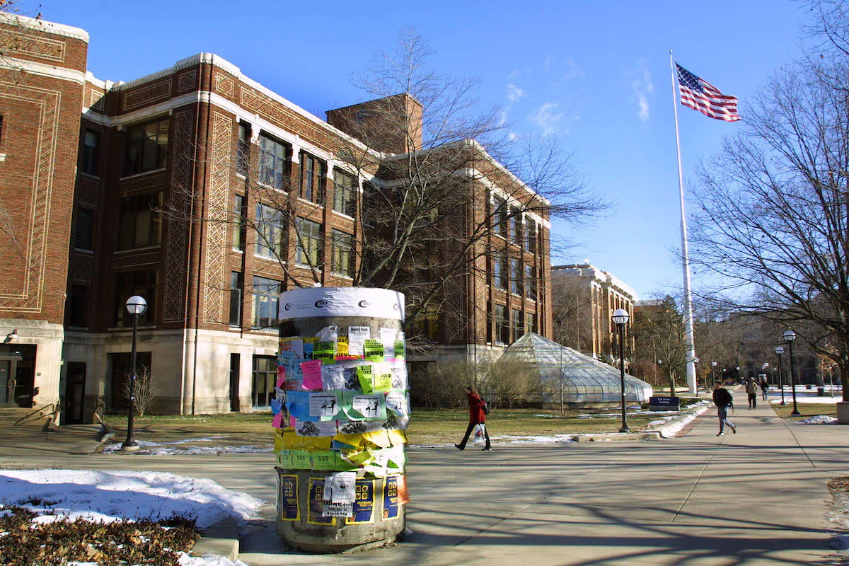 Students walk across the University of Michigan campus in Ann Arbor, Michigan. The university is one of five that reportedly has undisclosed ties with a leading Chinese military research university sanctioned by the United States. (Bill Pugliano/Getty Images)