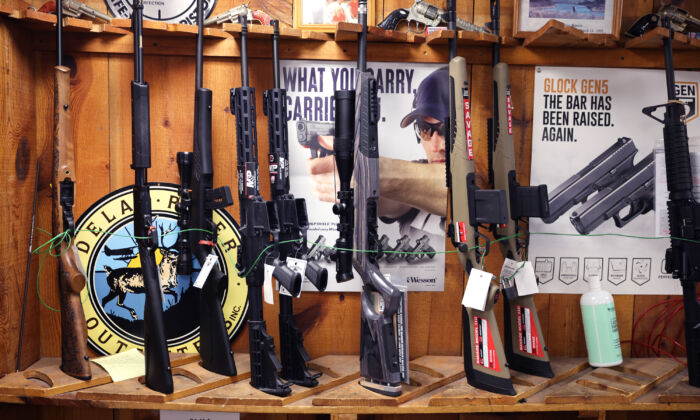 Rifles are offered for sale at Freddie Bear Sports in Tinley Park, Ill., on April 8, 2021. (Scott Olson/Getty Images)