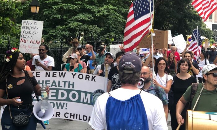 Protestors participate in a march against vaccine mandates around New York City Hall in Manhattan on Aug. 9, 2021. (Enrico Trigoso/The Epoch Times)