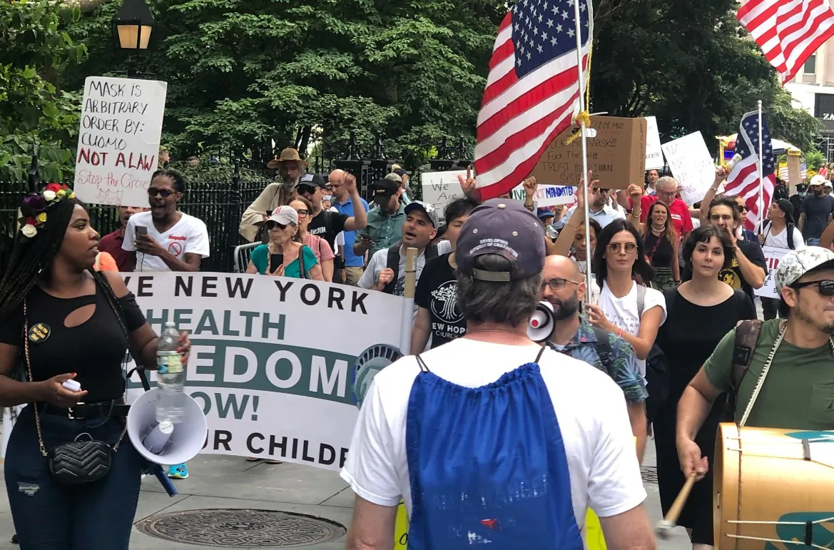 Protestors participate in a march against vaccine mandates around New York City Hall in Manhattan on Aug. 9, 2021. (Enrico Trigoso/The Epoch Times)