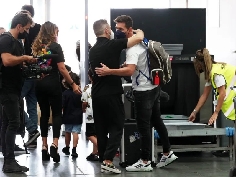 Lionel Messi is seen with his wife Antonela and their children before flying to Paris at Josep Tarradellas Barcelona-El Prat Airport, in Barcelona, Spain, on Aug. 10, 2021. (Albert Gea/Reuters)