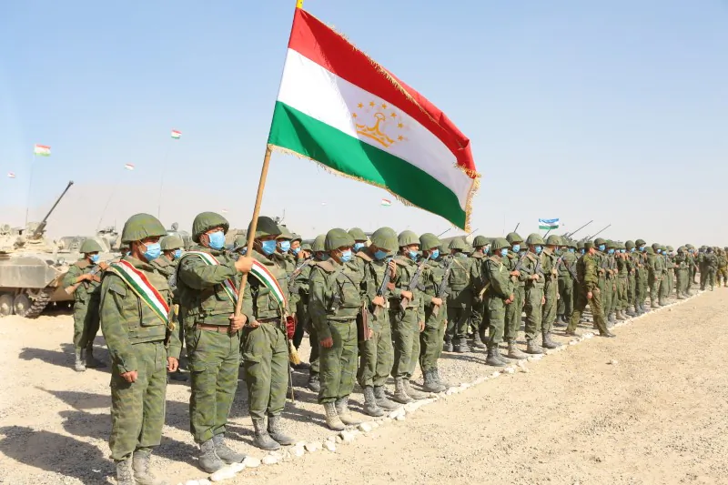 Service members of Tajikistan's armed forces line up during the joint military drills involving Russia, Uzbekistan, and Tajikistan, at the Harb-Maidon training ground, located near the Tajik-Afghan border in the Khatlon Region of Tajikistan on Aug. 10, 2021. (Didor Sadulloev/Reuters)