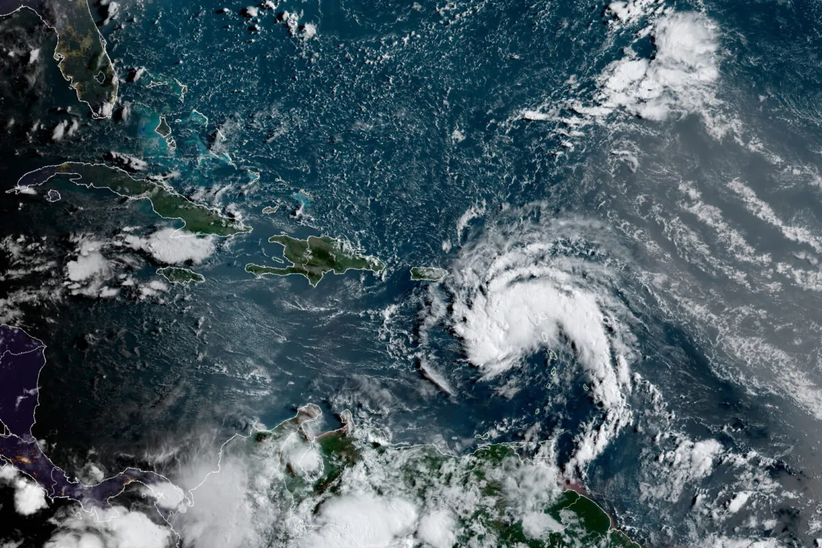 A tropical storm east of Puerto Rico in the Caribbean, at 7:50 a.m. ET, on Aug. 10, 2021. (NOAA/NESDIS/STAR GOES via AP)