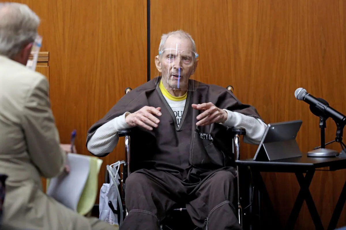New York real estate scion Robert Durst, 78, answers questions from defense attorney Dick DeGuerin (L) while testifying in his murder trial at the Inglewood Courthouse in Inglewood, Calif., on Aug. 9, 2021. (Gary Coronado/Pool/Los Angeles Times via AP)