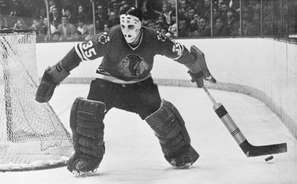 Chicago Blackhawks goalie Tony Esposito moves behind the net