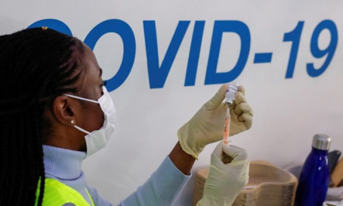 A dose of AstraZeneca vaccine is prepared at COVID-19 vaccination centre in the Odeon Luxe Cinema in Maidstone, UK, on Feb. 10, 2021. (Andrew Couldridge/Reuters)