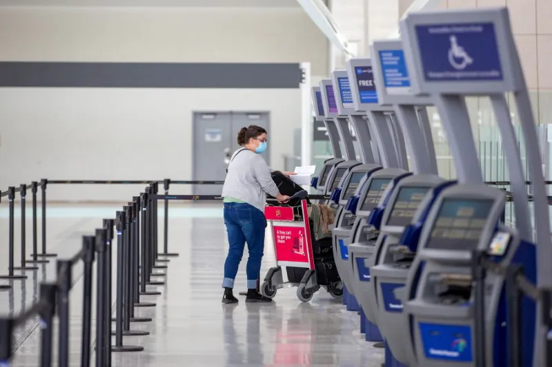 A person walks through Terminal 1 at Toronto's Pearson Airport on Feb. 15, 2021. Canada on Nov. 26 banned entry to foreign nationals who have travelled to southern Africa to prevent the spread of a new variant of concern discovered in the region.(Carlos Osorio/Reuters)