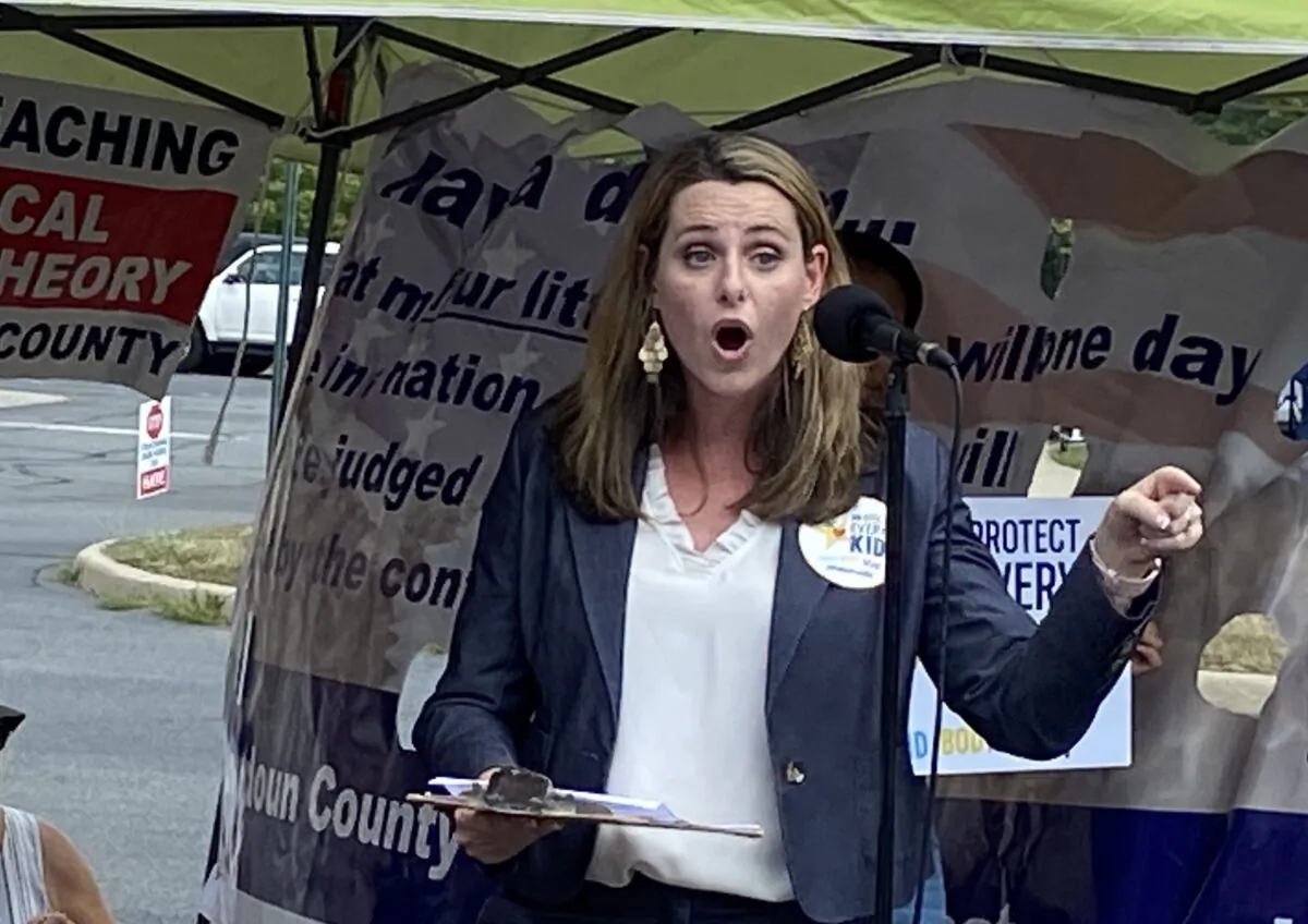 Victoria Cobb, president of the Family Foundation, spoke at the rally outside the Loudoun County school administration building on Aug. 10, 2021. (Terri Wu/The Epoch Times)