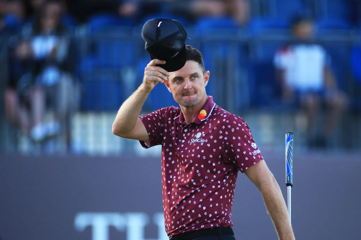 Justin Rose of England acknowledges the fans on the 18th hole during Day Two of The 149th Open at Royal St George’s Golf Club in Sandwich, England, on July 16, 2021. (Oisin Keniry/Getty Images)