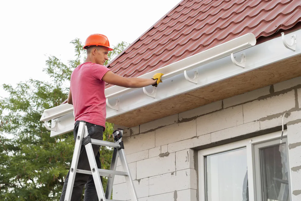 You can typically save about 50 percent of the total cost by installing the gutters yourself. (Shutterstock)