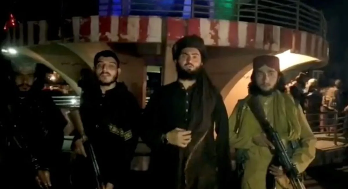 Taliban terrorists record a message after seizing Pul-e- Khumri, capital of Baghlan province, Afghanistan, in this still image taken from a social media video, uploaded on Aug. 10, 2021. (Taliban Handout via Reuters)