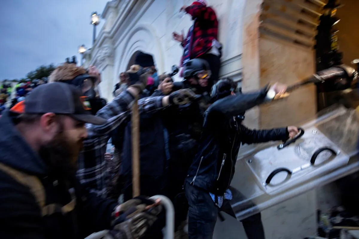 A crowd clashes with law enforcement officers at the U.S. Capitol in Washington on Jan. 6, 2021. (Brent Stirton/Getty Images)