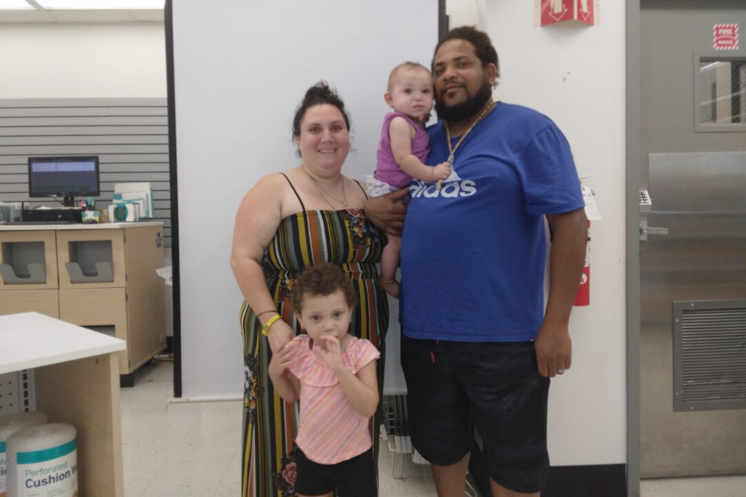 Jaime and Ryan Rose with their older daughter Armani and baby Ariana whose routine bruising from a breech birth prompted Child Protection Services to take their children. Photo taken August 2021. (Photo courtesy of Jaimie and Ryan Rose)