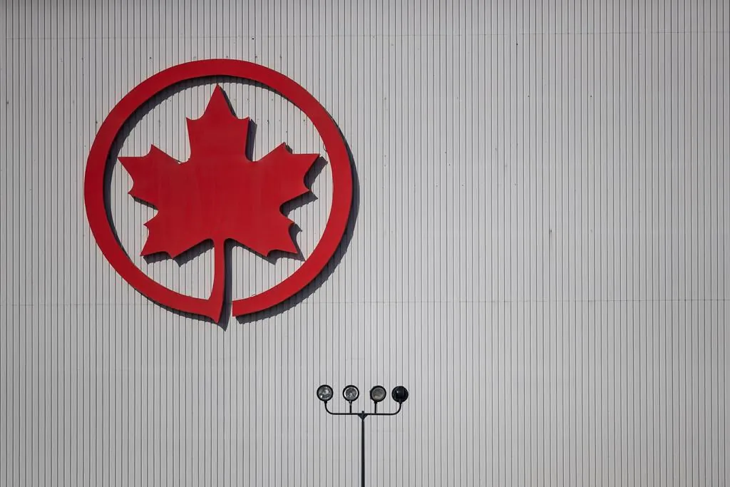 The Air Canada logo is seen on a hangar at Vancouver International Airport, in Richmond, B.C., on March 20, 2020.  (The Canadian Press/Darryl Dyck)