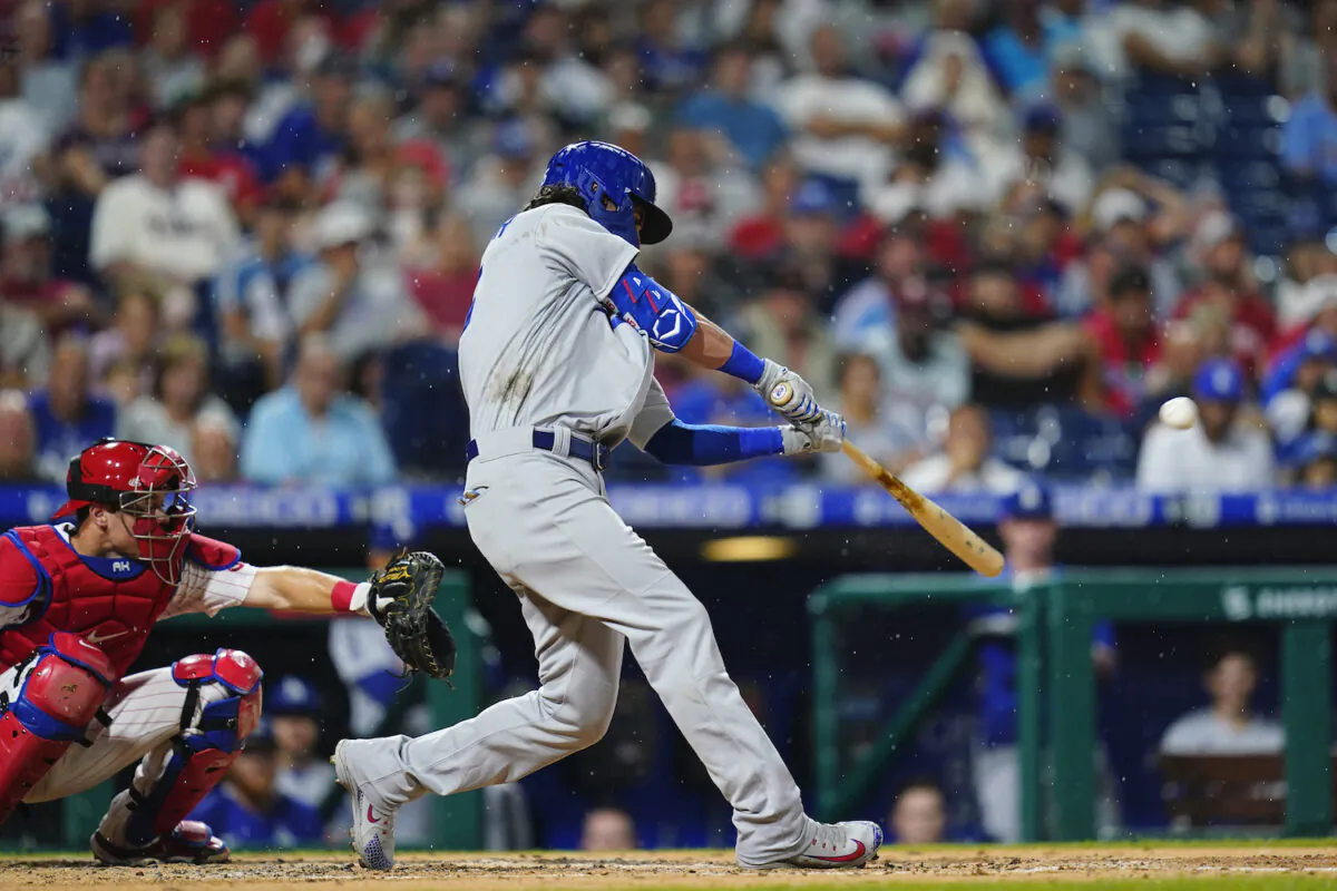 Los Angeles Dodgers' Cody Bellinger hits a two-run home run off Philadelphia Phillies pitcher Kyle Gibson during the fourth inning of a baseball game in Philadelphia on Aug. 11, 2021. (AP Photo/Matt Slocum)