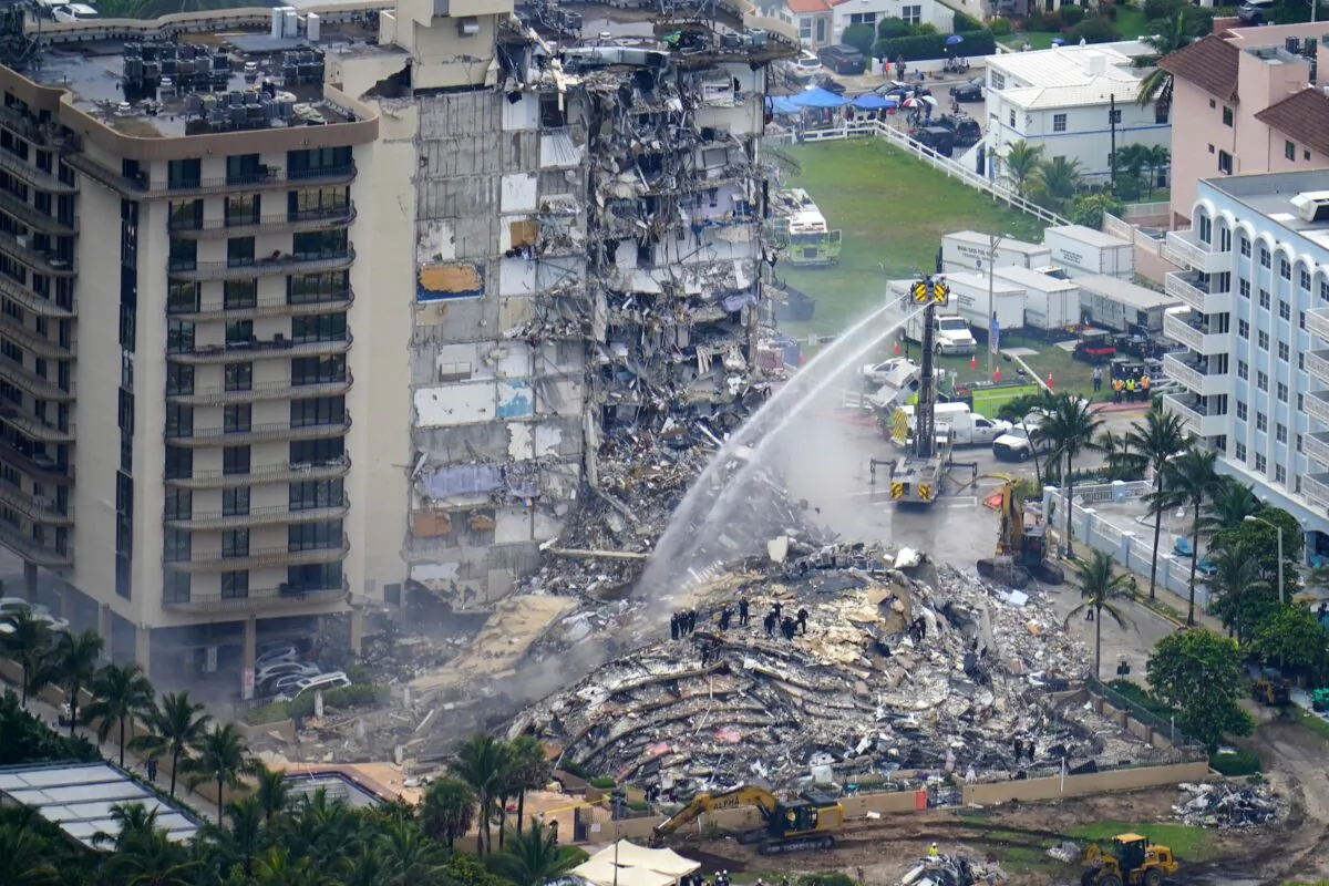 Rescue personnel work at the remains of the Champlain Towers South condo building in Surfside, Fla., on June 25, 2021. (Gerald Herbert/AP Photo)