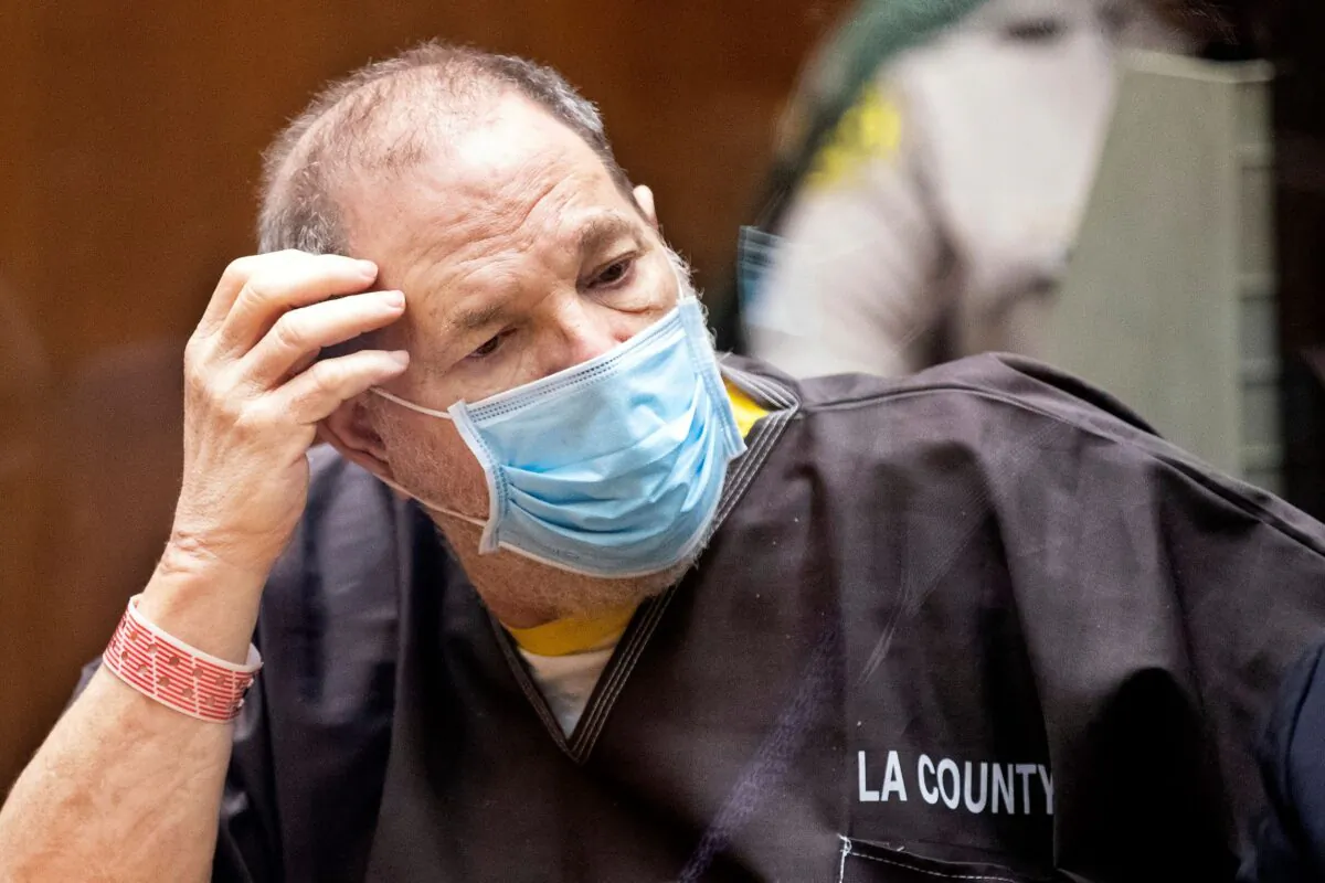 Harvey Weinstein, the 69-year-old convicted rapist and disgraced movie mogul, wears a face mask as he listens in court during a pre-trial hearing in Los Angeles on July 29, 2021. (Etienne Laurent/Pool Photo via AP)