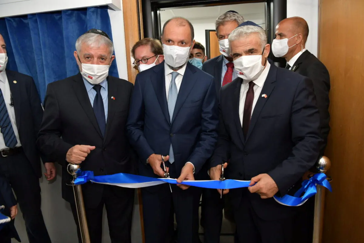 Israeli Foreign Minister Yair Lapid inaugurates Israel's diplomatic mission, in the presence of Minister Delegate to the Moroccan Foreign Ministry Mohcine Jazouli, in Rabat, Morocco, on Aug. 12, 2021. (Israel Ministry of Foreign Affairs/Handout via Reuters)