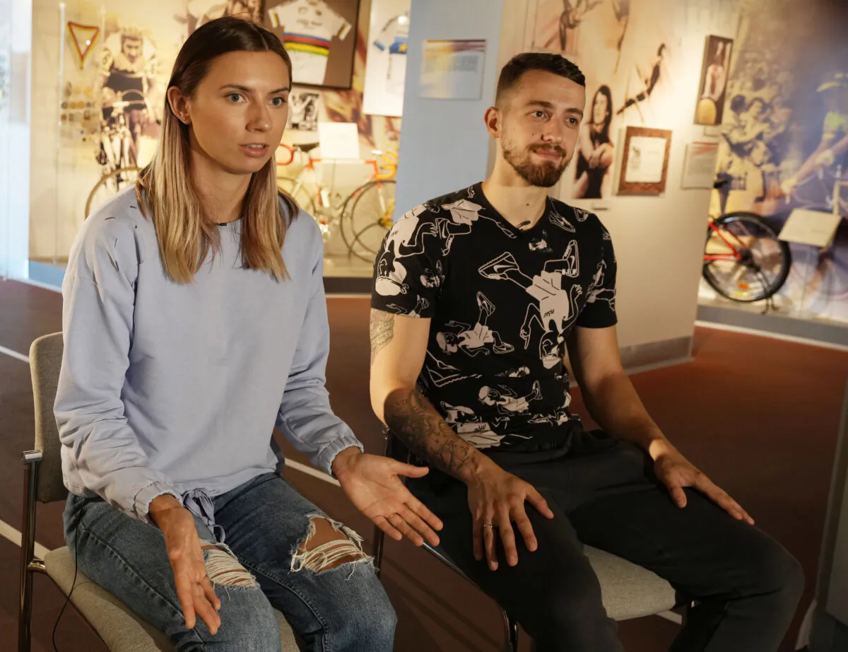 Belarusian Olympic sprinter Krystsina Tsimanouskaya (L) and her husband Arseni Zdanevich (R) speak to The Associated Press in Warsaw, Poland, on Aug. 11, 2021. (Czarek Sokolowski/AP Photo)