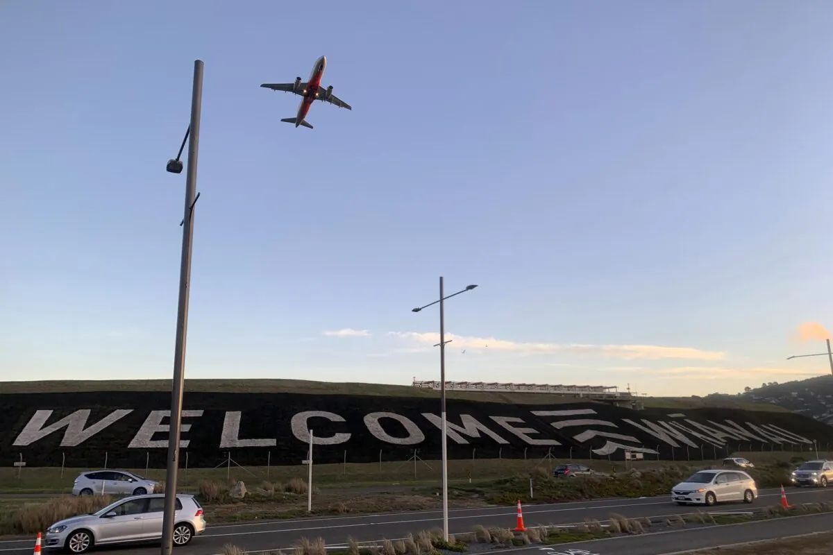 A giant sign painted near the main runway of the Wellington International Airport greets travelers returning home in Wellington, New Zealand, on April 19, 2021. (Nick PerryAP Photo)