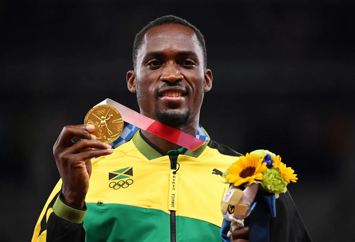 Gold medallist, Hansle Parchment of Jamaica poses on the podium at the men's 110 meter hurdles Tokyo 2020 Olympics medal ceremony in Tokyo, Japan, on Aug. 5, 2021. (Dylan Martinez/File Photo/Reuters)
