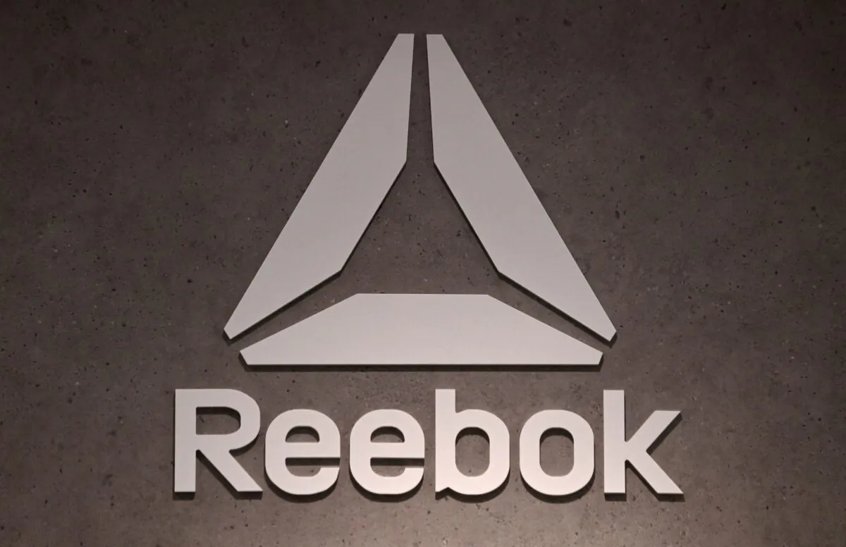 The logo of footwear and clothing company Reebok, a subsidiary of German sporting goods giant Adidas, is seen in a store in Munich, southern Germany, on March 10, 2021. (Christof Stache/AFP via Getty Images)