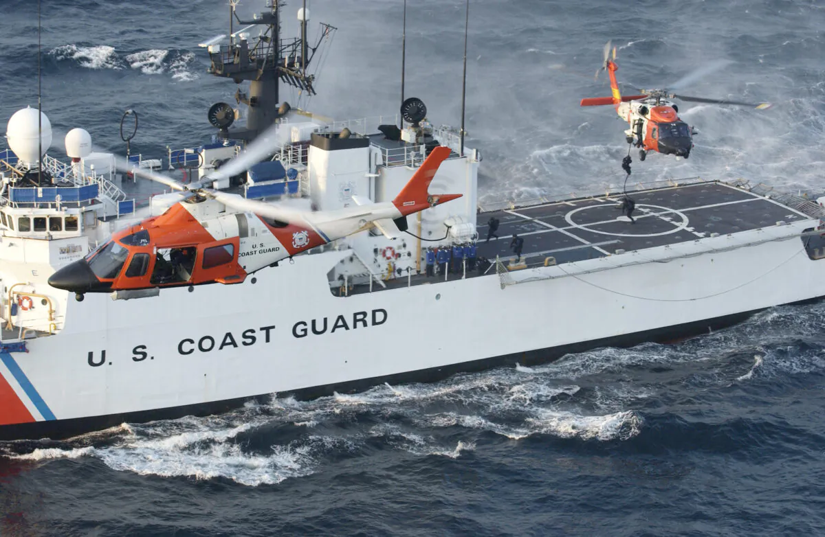 A Coast Guard maritime security force practices fast-roping to the Coast Guard cutter Seneca's flight deck eight miles south of Rockaway, New York, on Aug. 28, 2004. (Mike Hvozda/U.S. Coast Guard via Getty Images)