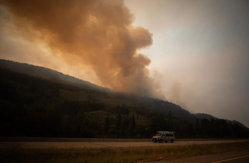 The July Mountain wildfire burns along the Coquihalla Highway south of Merritt, B.C., on August 11, 2021. (The Canadian Press/Darryl Dyck)