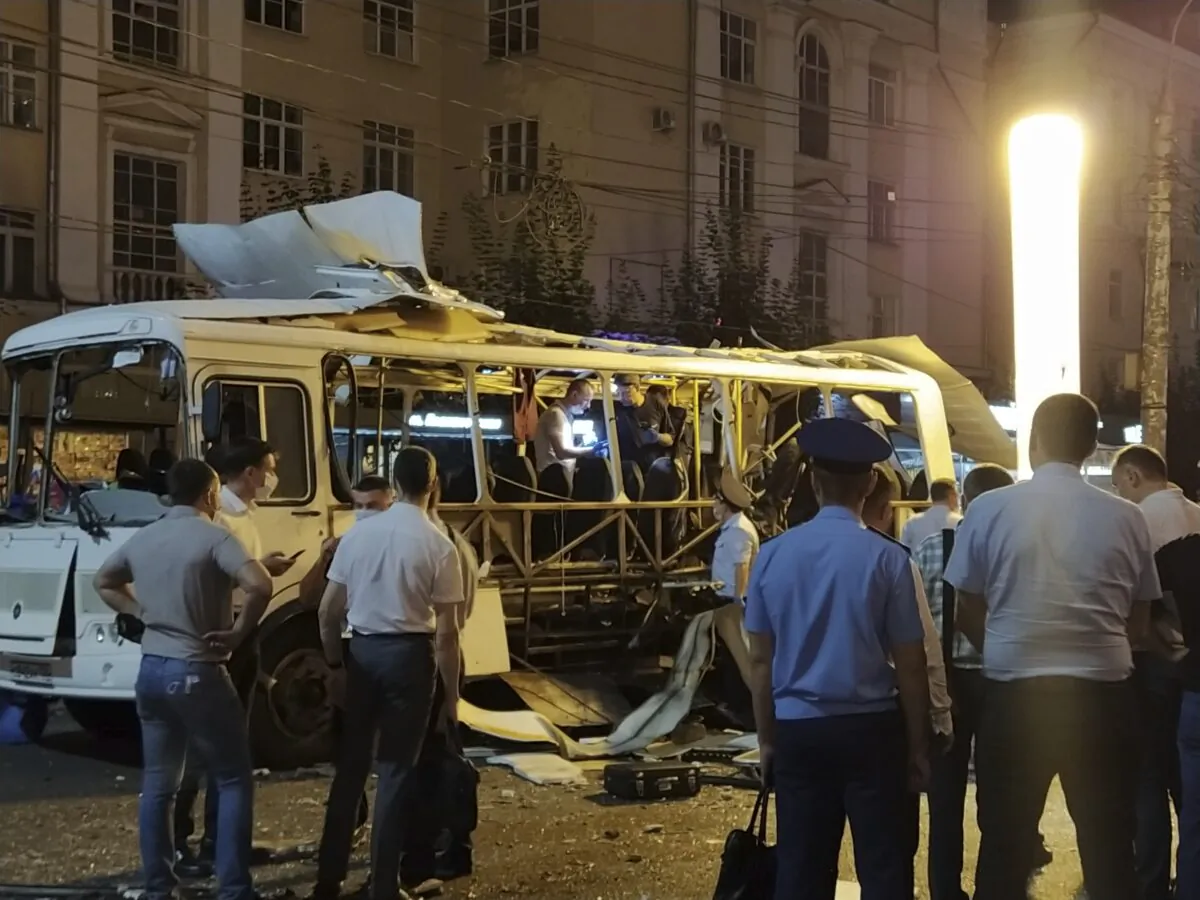 Police and investigators work at a site of an explosion on a city bus in Voronezh, Russia, on Aug. 12, 2021. (Kristina Brazhnikova/AP Photo)