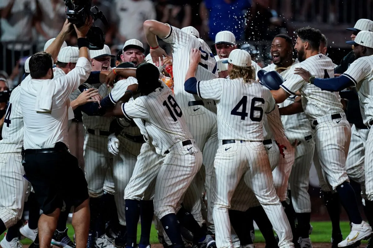 Chicago White Sox's Tim Anderson celebrates his walk-off home run against the New York Yankees in the ninth inning during a baseball game, in Dyersville, Iowa, on Aug. 12, 2021. (Charlie Neibergall/AP Photo)