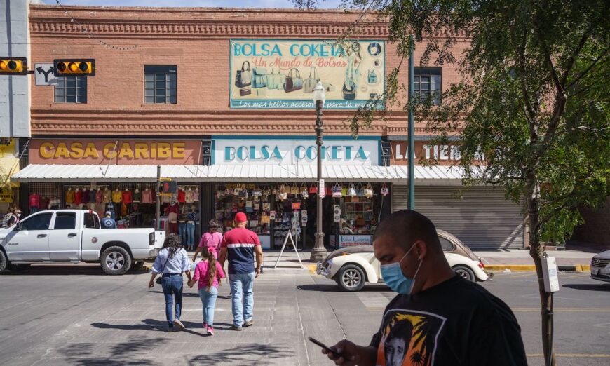 People wearing masks amid the Covid-19 pandemic are pictured on Oct.24, 2020, in downtown El Paso, Texas. (Paul Ratje/AFP) 