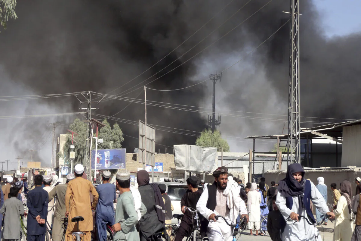 Smoke rises after fighting between the Taliban and Afghan security personnel in the city of Kandahar province south of Kabul, Afghanistan, on Aug. 12, 2021. (Sidiqullah Khan/AP Photo)