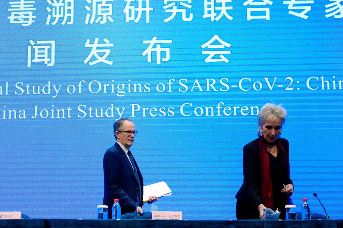 Peter Ben Embarek and Marion Koopmans, members of the WHO team arrive for the WHO-China joint study news conference at a hotel in Wuhan, Hubei province, China, on Feb. 9, 2021. (Aly Song/Reuters)