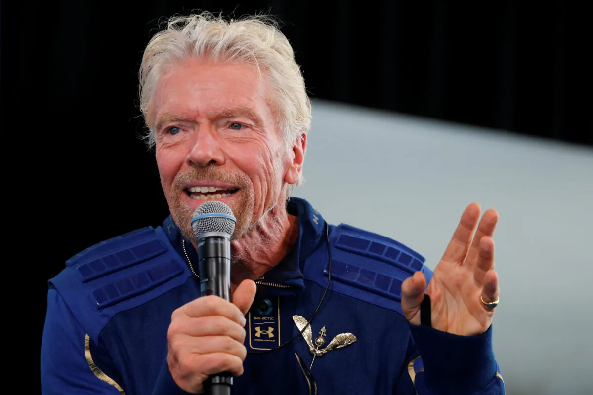 Billionaire entrepreneur Richard Branson wears his astronaut's wings at a news conference, after flying with a crew in Virgin Galactic's passenger rocket plane VSS Unity to the edge of space at Spaceport America near Truth or Consequences, N.M., on July 11, 2021. (Joe Skipper/Reuters)