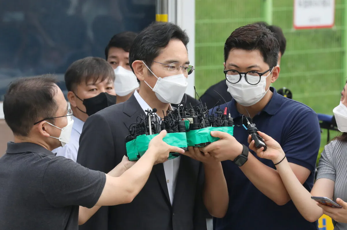 Samsung Electronics vice chairman Jay Y. Lee speaks as he is released on parole from Seoul Detention Center in Uiwang, South Korea on Aug. 13, 2021. (Yonhap via Reuters)