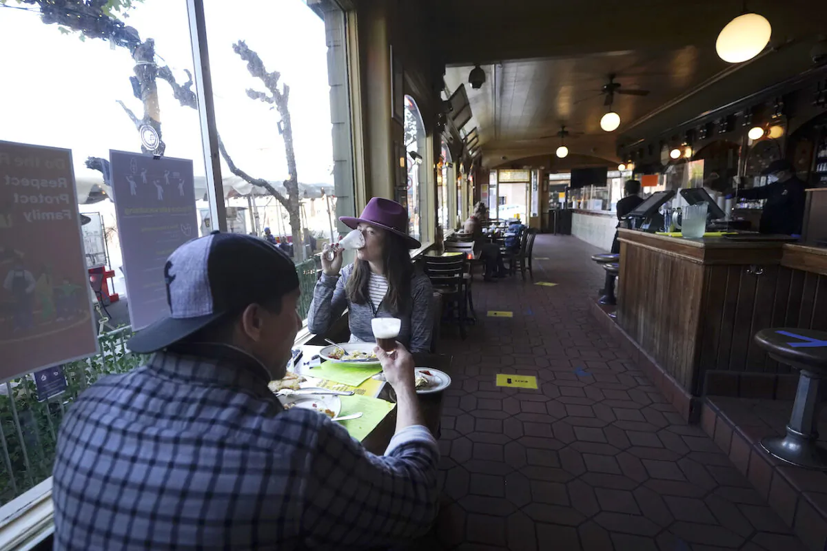 Diners eat inside at the Buena Vista Cafe in San Francisco on Nov. 12, 2020. (Jeff Chiu/AP Photo)