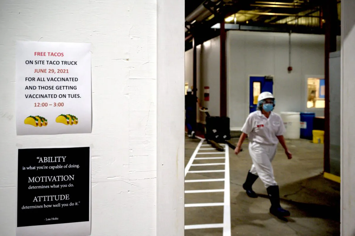 A sign encouraging employees to get vaccinated against COVID-19 is displayed at the Vermont Creamery in Websterville, Vt., on June 29, 2021. (ED JONES/AFP via Getty Images)