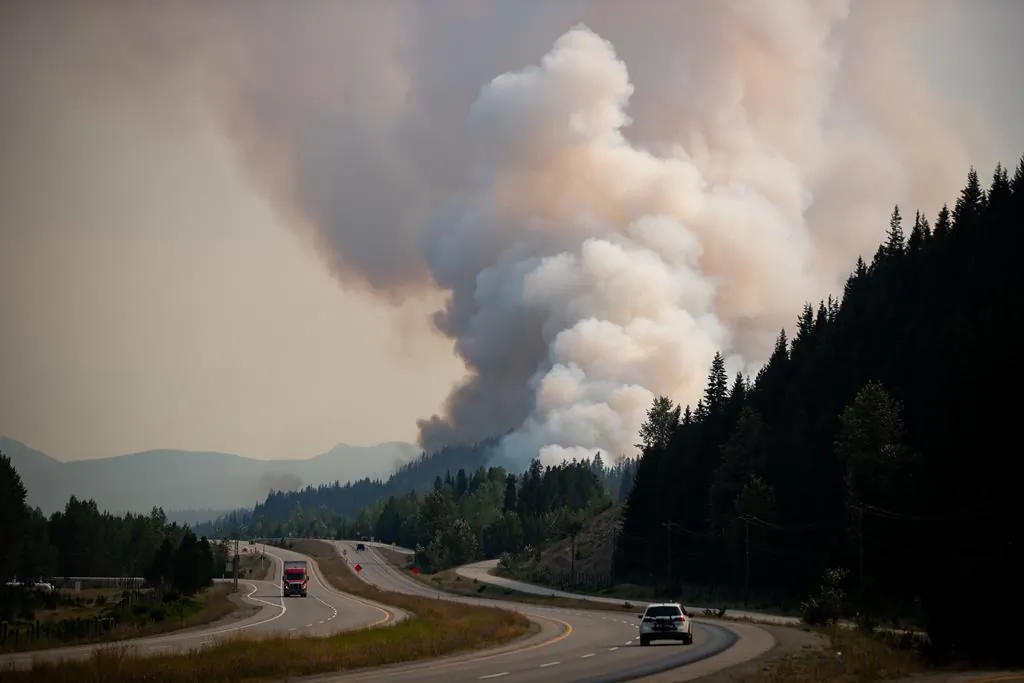 The July Mountain wildfire burns along the Coquihalla Highway south of Merritt, B.C., on Aug. 11, 2021. (The Canadian Press/Darryl Dyck)