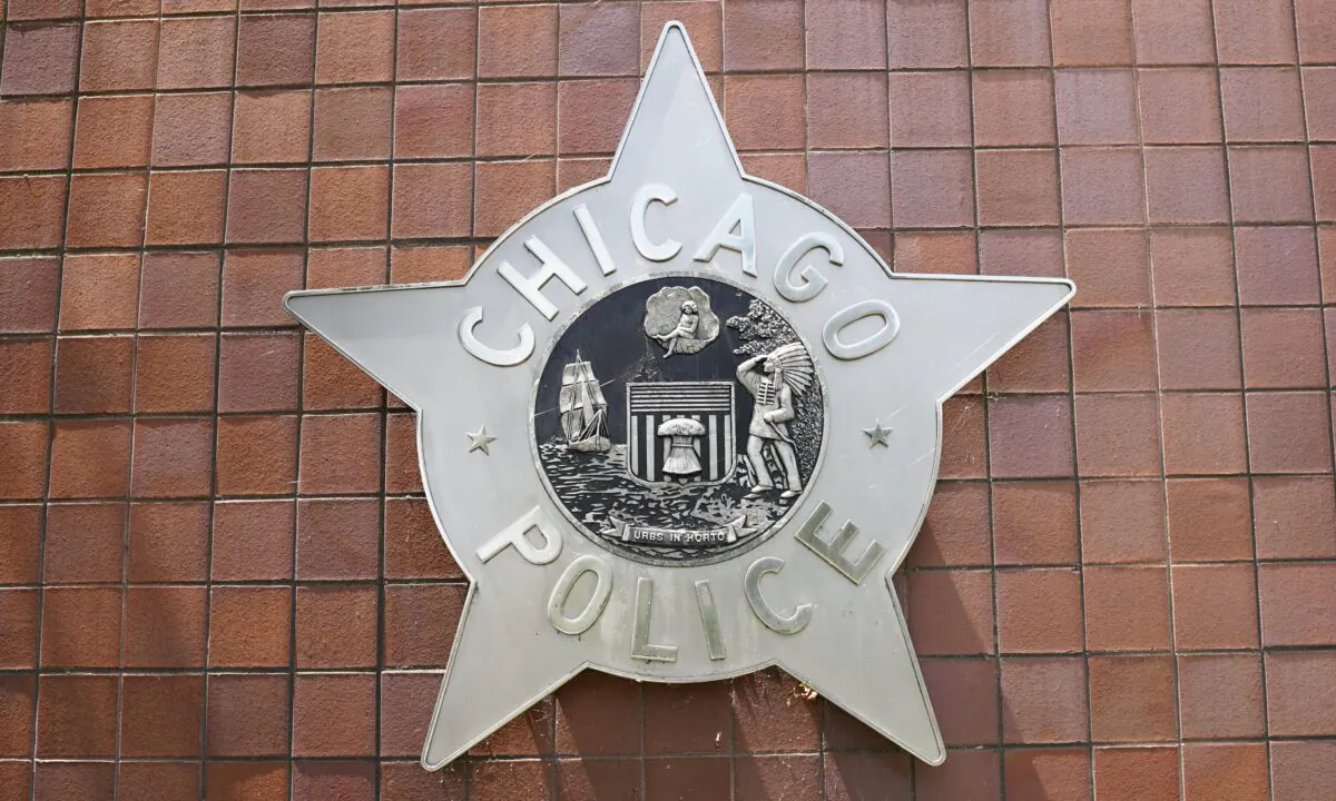 A chicago police plaque fixed unto the Chicago Police Department headquarter building in Chicago, Ill. on May 26, 2021. (Cara Ding/The Epoch Times)