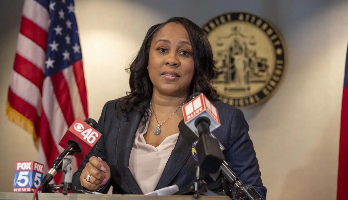 Fulton County District Attorney Fanni Willis speaks during a news conference at the Fulton County Courthouse in downtown Atlanta, on Aug. 13, 2021. (Alyssa Pointer/Atlanta Journal-Constitution via AP)