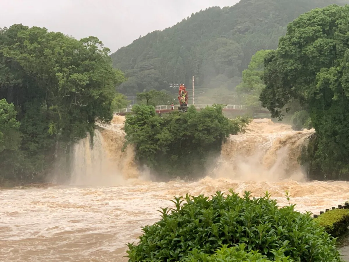 A general view shows muddy water during floods at Todorokinotaki water park in Ureshino city, Saga Prefecture, Japan, on Aug. 14, 2021. (Twitter @Konoemon321/via Reuters)