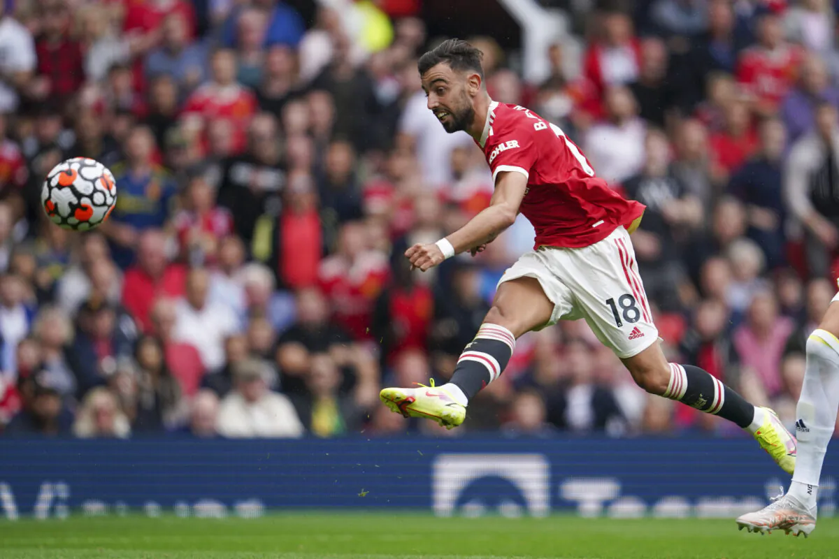 Manchester United’s Bruno Fernandes scores his third goal during the English Premier League soccer match between Manchester United and Leeds United at Old Trafford in Manchester, England, on Aug. 14, 2021. (Jon Super/AP Photo)