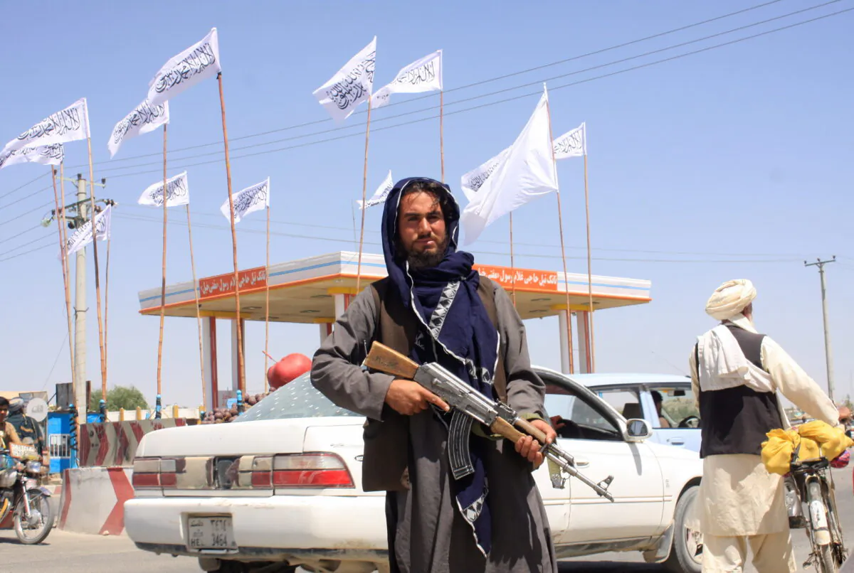 A Taliban terrorist looks on as he stands at the city of Ghazni, Afghanistan, on Aug. 14, 2021. (Stringer/Reuters)