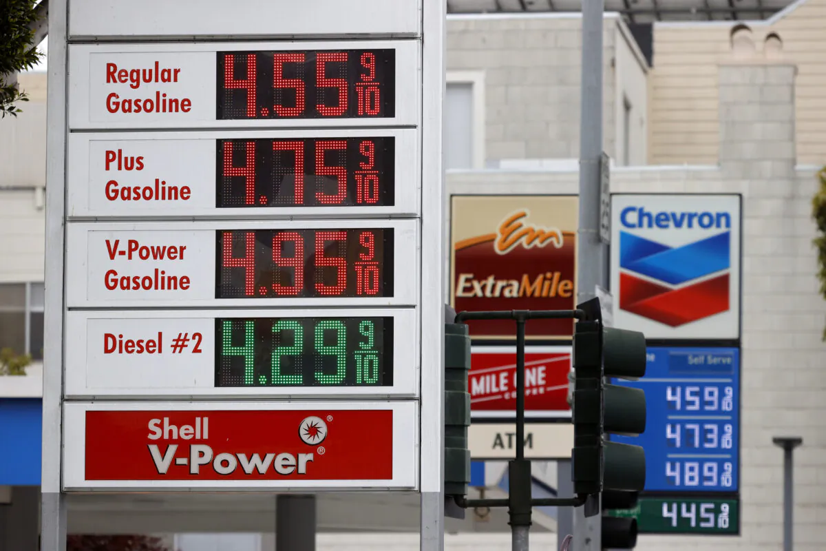 Gas prices nearing $5.00 a gallon are displayed at Chevron and Shell stations in San Francisco, Calif., on July 12, 2021. (Justin Sullivan/Getty Images)