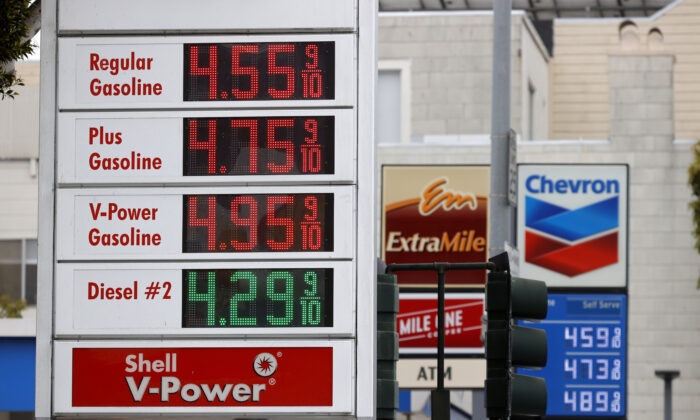 Gas prices nearing $5.00 a gallon are displayed at Chevron and Shell stations in San Francisco, Calif., on July 12, 2021. (Justin Sullivan/Getty Images)