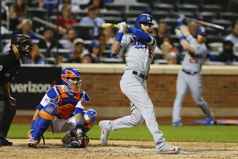 Los Angeles Dodgers center fielder Cody Bellinger (35) follows through on a double against the New York Mets  during the tenth inning of a baseball game in New York on Aug. 14, 2021. 
(AP Photo/Noah K. Murray)